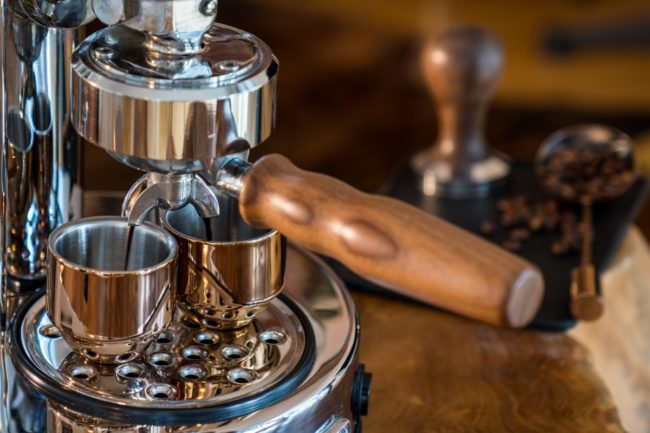 Pouring fresh espresso with high end Barista Espresso Machine at home Pouring fresh espresso with high end Barista Espresso Machine at home