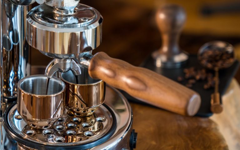 Pouring fresh espresso with high end Barista Espresso Machine at home Pouring fresh espresso with high end Barista Espresso Machine at home