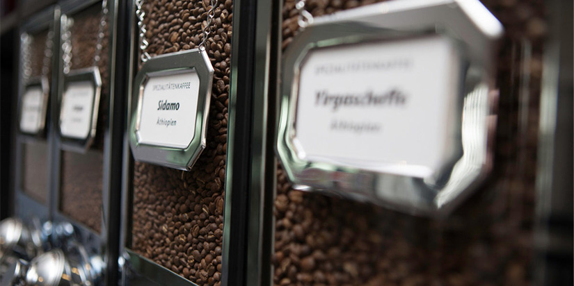 roasted-coffee-beans-in-dispenser-coffee-shop