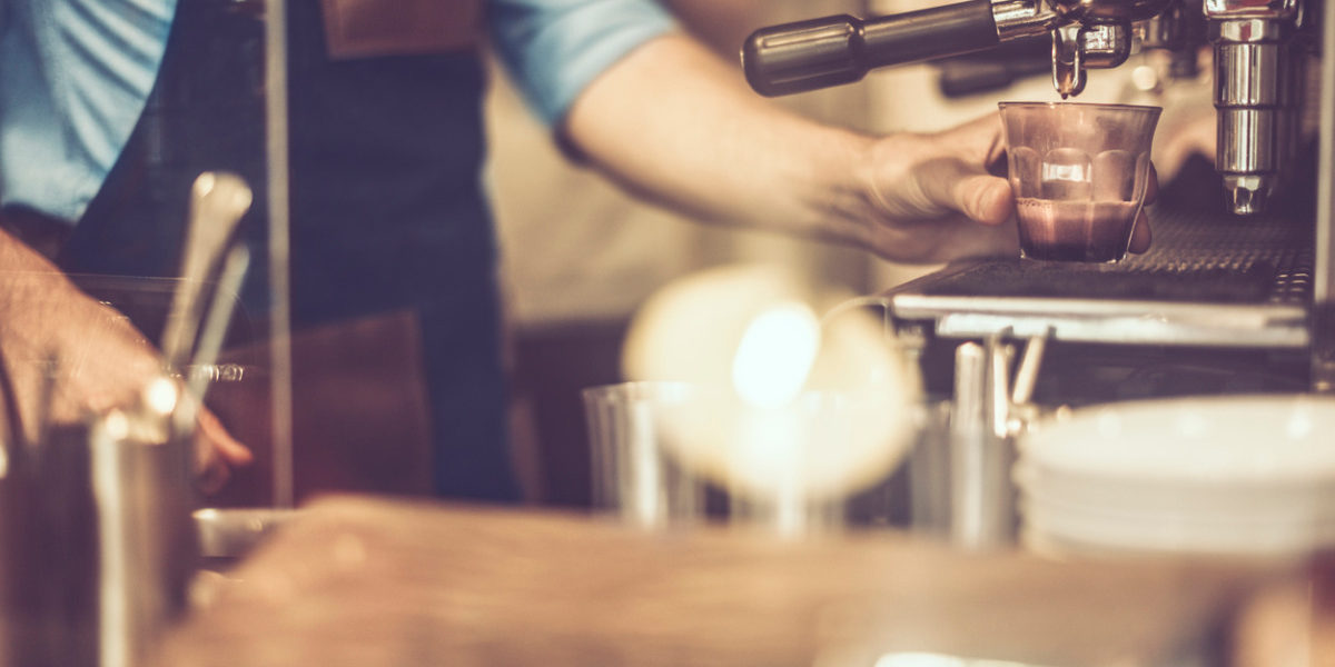 young-barista-is-making-a-coffee