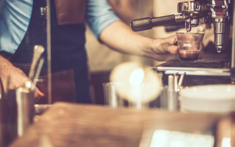 young-barista-is-making-a-coffee young-barista-is-making-a-coffee